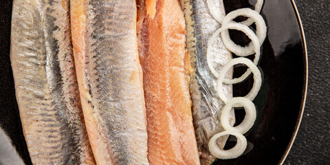 Herring fillet fish fresh seafood portion size natural product tasty snack fresh delicious gourmet food background on the table rustic top view copy space pescetarian diet