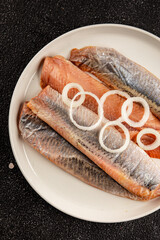 Herring fillet fish fresh seafood portion size natural product tasty snack fresh delicious gourmet food background on the table rustic top view copy space pescetarian diet