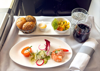 First course of a lunch meal in the business class cabin of a passenger jet
