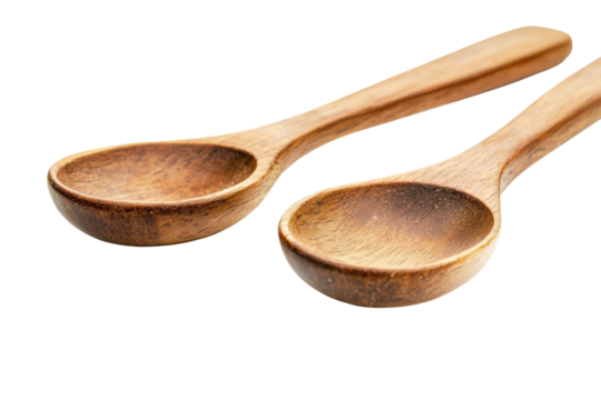 Two wooden spoons isolated on a transparent background close up
