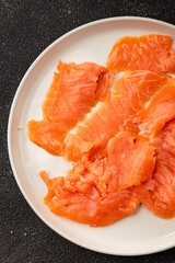 Smoked salmon fish seafood portion size natural product tasty snack fresh delicious gourmet food background on the table rustic top view copy space pescetarian diet