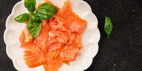 Smoked salmon fish seafood portion size natural product tasty snack fresh delicious gourmet food background on the table rustic top view copy space pescetarian diet