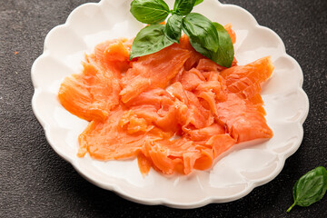 Smoked salmon fish seafood portion size natural product tasty snack fresh delicious gourmet food background on the table rustic top view copy space pescetarian diet