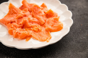 Smoked salmon fish seafood portion size natural product tasty snack fresh delicious gourmet food background on the table rustic top view copy space pescetarian diet