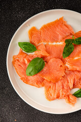 Smoked salmon fish seafood portion size natural product tasty snack fresh delicious gourmet food background on the table rustic top view copy space pescetarian diet