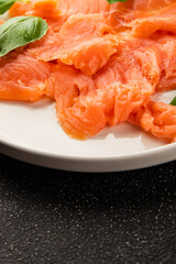 Smoked salmon fish seafood portion size natural product tasty snack fresh delicious gourmet food background on the table rustic top view copy space pescetarian diet