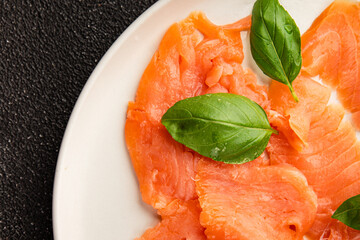 Smoked salmon fish seafood portion size natural product tasty snack fresh delicious gourmet food background on the table rustic top view copy space pescetarian diet