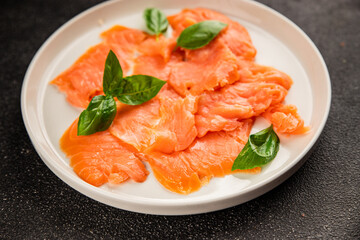 Smoked salmon fish seafood portion size natural product tasty snack fresh delicious gourmet food background on the table rustic top view copy space pescetarian diet