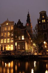 Kloveniersburgwal, Amsterdam, by night, with Zuiderkerk in the background.