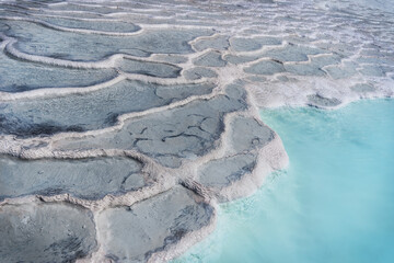 fantastic background created by white salt minerals covered in mountain water