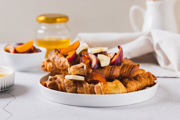 Homemade banana and berry croffles on a breakfast plate