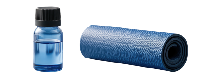 Oil bottle and rolled blue yoga mat on a black background