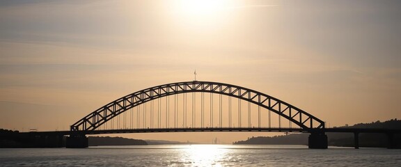 Obraz premium Sleek, dark bridge silhouette against a bright sky, monochrome, background