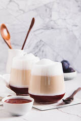 Homemade berry latte in glasses on the table vertical view