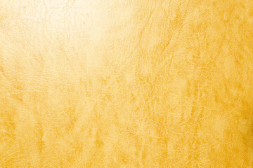 A close-up of a textured yellow leather surface. The leather has a smooth finish with subtle variations in color and pattern, showcasing its natural beauty.