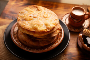 Mexican Buñuelos. Traditionally fried wheat tortillas used for Christmas and winter holidays, these are fried flour tortillas sprinkled with sugar or covered in a syrup made with piloncillo, cinnamon,