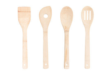 Set of light wooden kitchen spatulas and cooking spoons on isolated  white background
