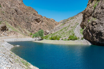 First lake named Nezhegon of the Seven Lakes. Clear blue and green water. Haft Kul, Sughd Province,...