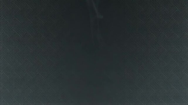 Abstract animation of a luminous, ethereal energy form dissolving into smoke-like particles against a dark, textured background