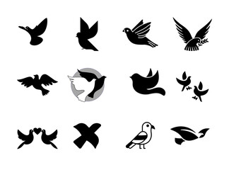 Collection of stylized black silhouette flying doves and pigeons with olive branches symbolizing peace and freedom