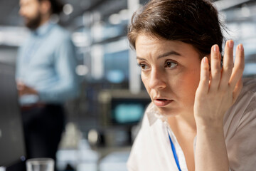 Data center admin inspecting infrastructure, doing maintenance tasks, checking diagnostics. Server hub IT professional conducting system checks to ensure stability across network racks, close up
