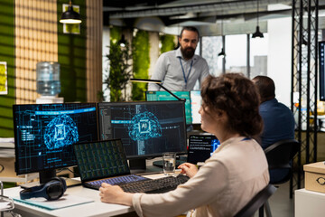 Office administrator checking monthly reports with AI analytics platform, employing neural networks...