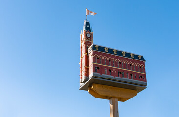 Close-up of a Very Elaborate Birdhouse Isolated on Blue