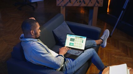 African american expert closing monthly revenue balance on web platform, working remotely on accounting analysis. Financial analyst managing expenses and insurances before investing. Camera A.