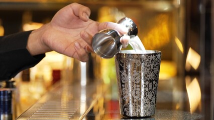 Closeup mixing hand bartender holding jigger to measure sugar salt all of ingredients into shaker...