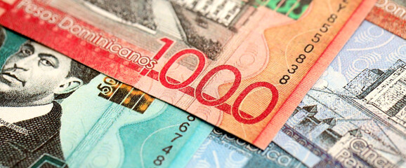 Dominican Republic Pesos currency money bills. DOP currency banknotes in big amount with different denomination close up