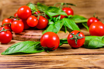 Heap of small cherry tomatoes on wooden table