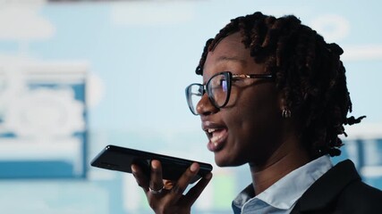 Businesswoman sharing voice note to coworker on phone, reviewing performance metrics. Team leader using smartphone to send audio message to business partner, evaluating annual report data, close up - Powered by Adobe
