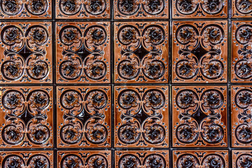 Old vintage ceramic tiles for the decoration stoves and fireplaces. Background, texture