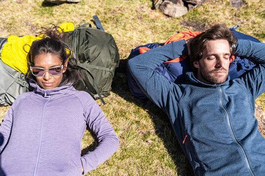 Eco travel couple embracing slow mountain adventure