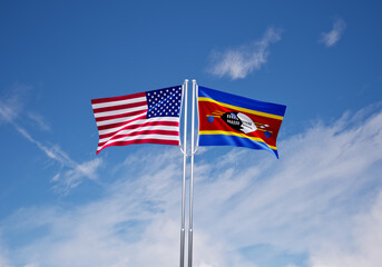 flags of  Eswatini and United States of America over blue sky background.