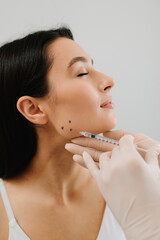 Bruxism injection facial for a treatment with botulinum toxin in an aesthetic medicine clinic....