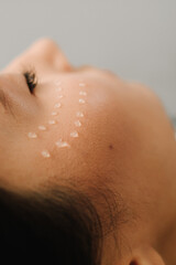 Fototapeta premium Cosmetologist is making facial mesotherapy injections for girl. Facial mesotherapy to rejuvenate skin and improve skin health and appearance.