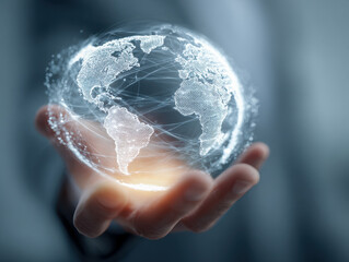 Person holding a glowing digital globe with interconnected lines representing global communication and technology in a futuristic concept