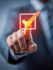 Businessman in a suit pressing a glowing orange checkmark icon, symbolizing approval, success, or task completion in a digital interface concept