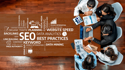 Team members engage in an SEO strategy meeting, discussing critical elements like backlinks,...