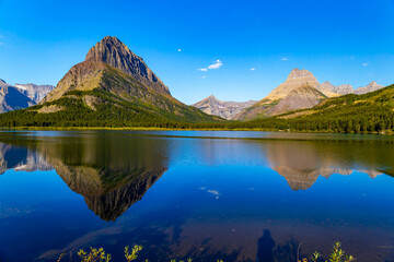 Beautiful sunrise at Swiftcurrent Lake in Glacier National Park