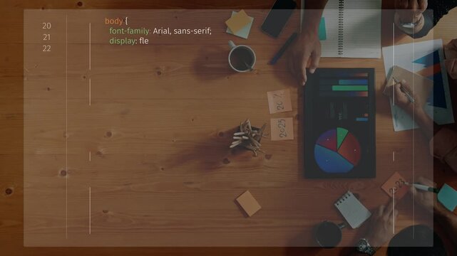 A creative workspace showcases coding and collaboration with programming tools on a wooden table. Ideal for concepts of teamwork, innovation, and productivity. Raster