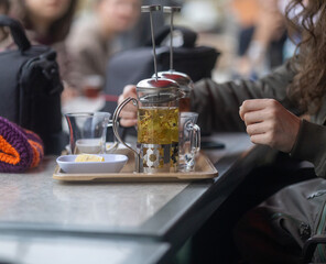 Close-Up of Herbal Tea Brewing in a French Press
