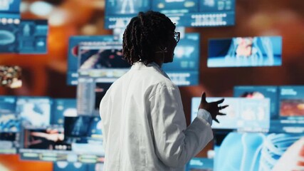 Happy doctor doing key note presentation on medical research data and 3D anatomy models dashboards. Joyous woman showing futuristic medical visuals on multimedia wall during conference, camera B - Powered by Adobe