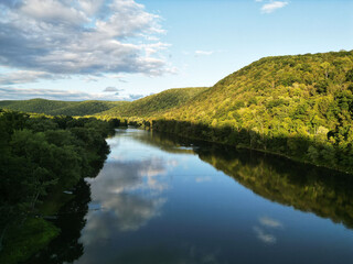 A drone shot of the sky reflecting off of the Allegheny River in Warren County, Pennsylvania, USA on a sunny summer day
