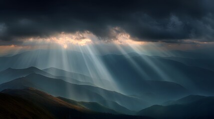 Dramatic sunbeams pierce dark clouds over layered mountain ranges.