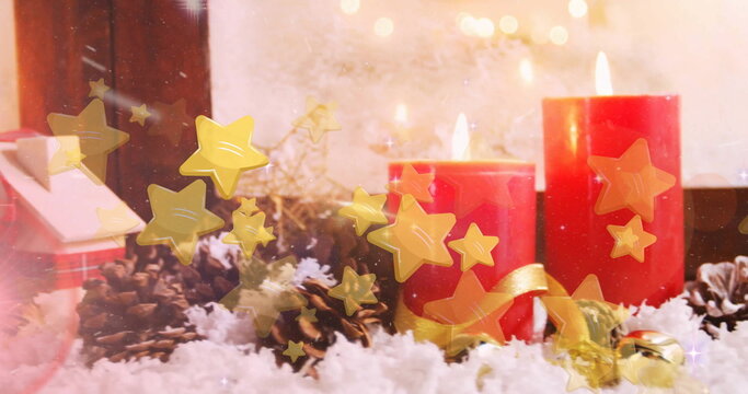 Naklejki Image of stars floating over christmas decorations