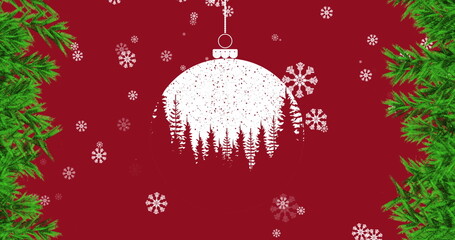 Image of snow falling over red christmas bauble and fir tree decoration