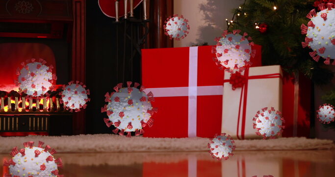 Image of covid 19 cells moving over christmas tree, presents and fireplace in the background