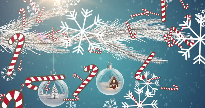 Naklejki Multiple candy cane icons falling against christmas decorations hanging on a branch